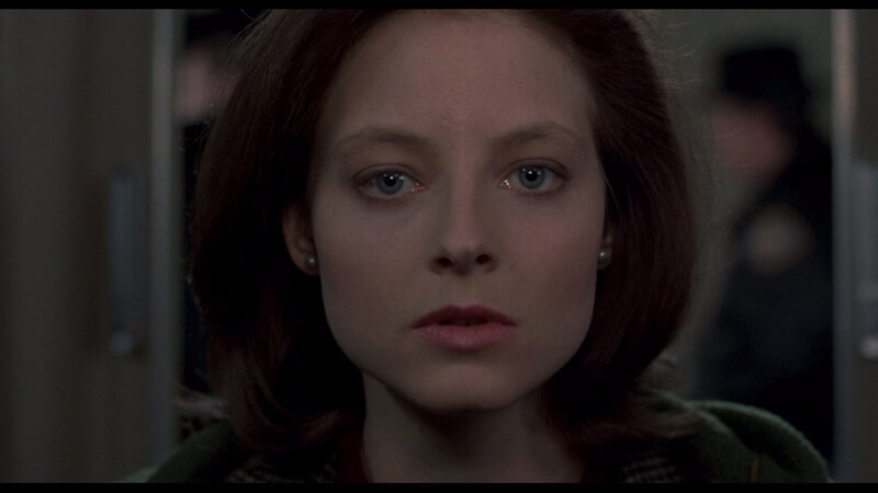 woman with blue eyes in dim light