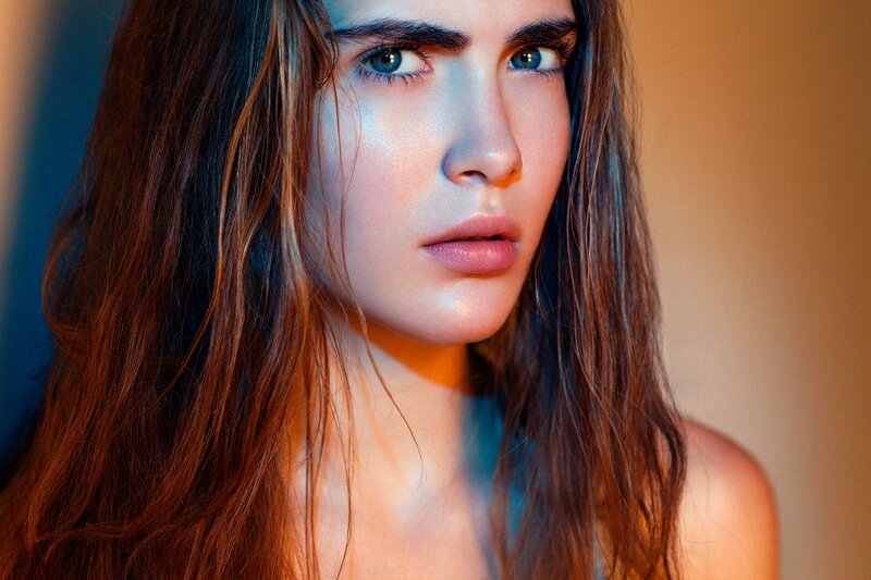 woman with blue eyes in dramatic lighting