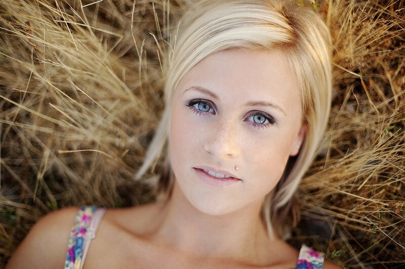 woman with blue eyes in field