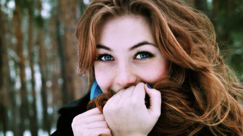 woman with blue eyes in forest