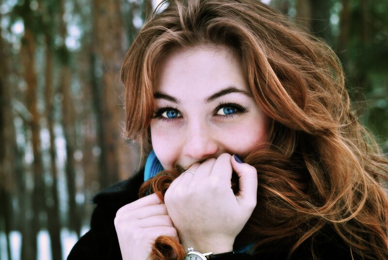 woman with blue eyes in forest