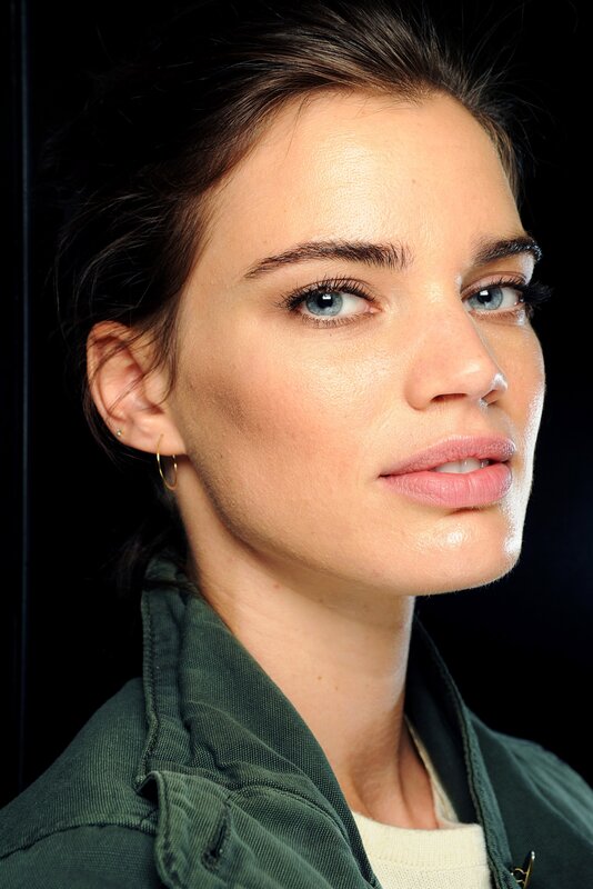 woman with blue eyes in green jacket