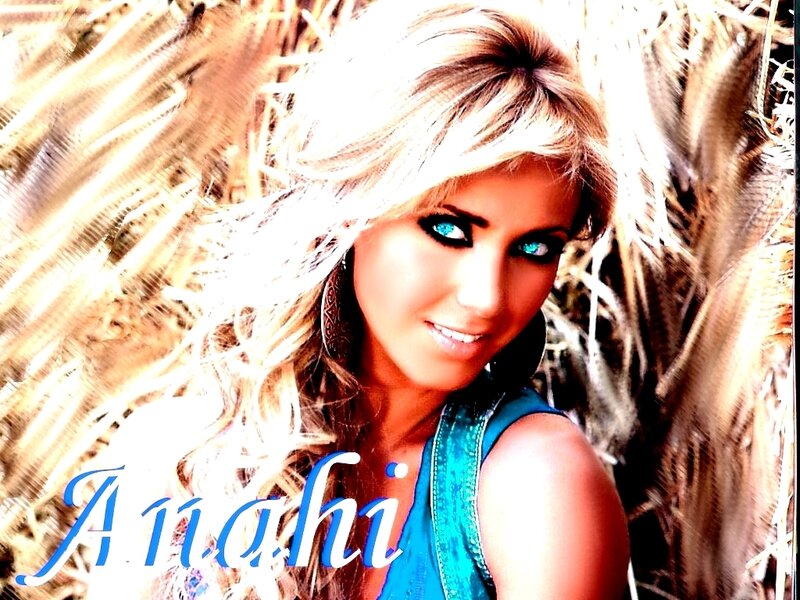 Woman with blue eyes in hay