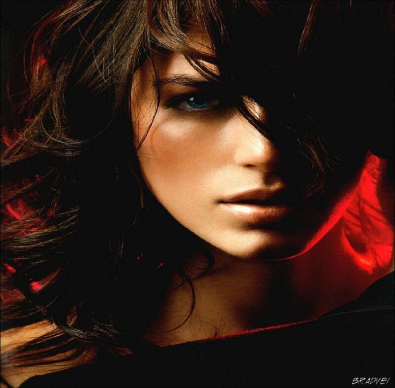 woman with blue eyes in red light