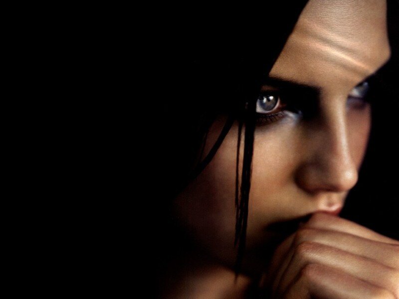 woman with blue eyes in shadow