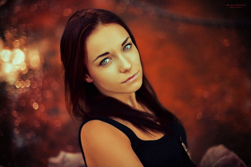 woman with blue eyes in warm light