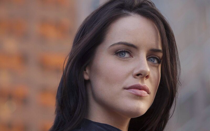 woman with blue eyes looking away