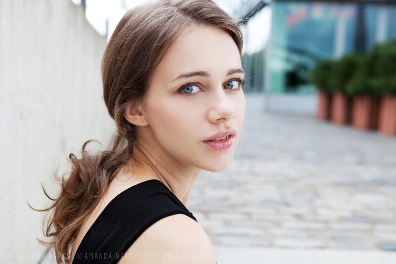 woman with blue eyes looking back