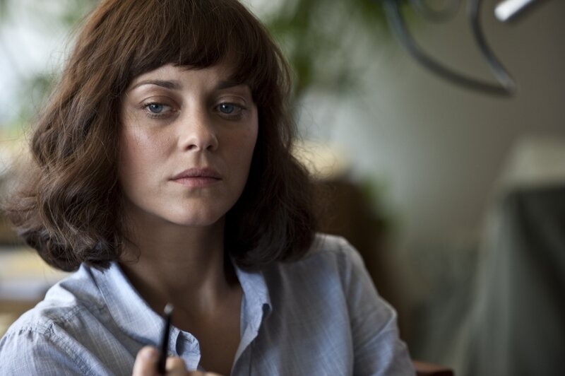 woman with blue eyes looking down