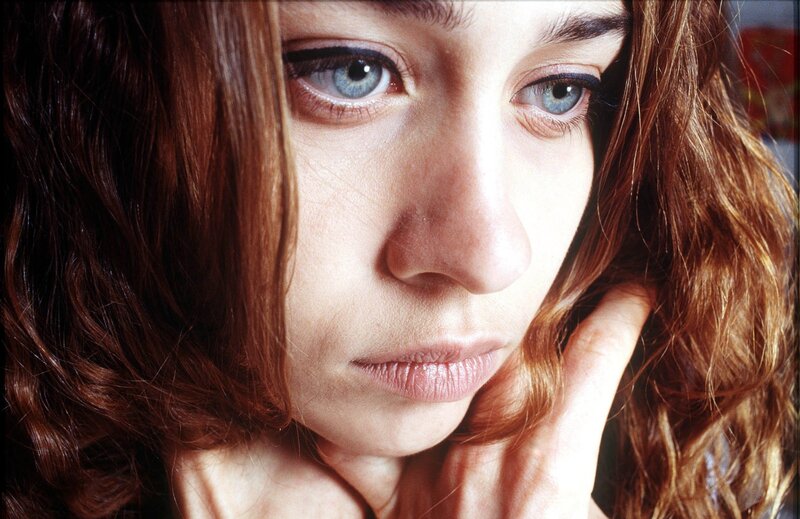 woman with blue eyes looking down