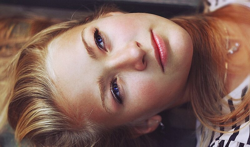 woman with blue eyes looking up