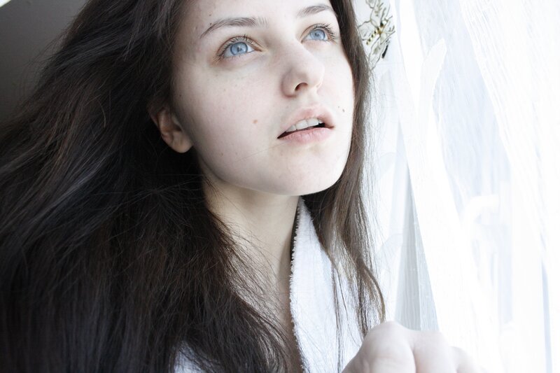 woman with blue eyes looking up