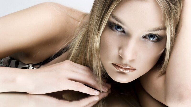 woman with blue eyes lying down
