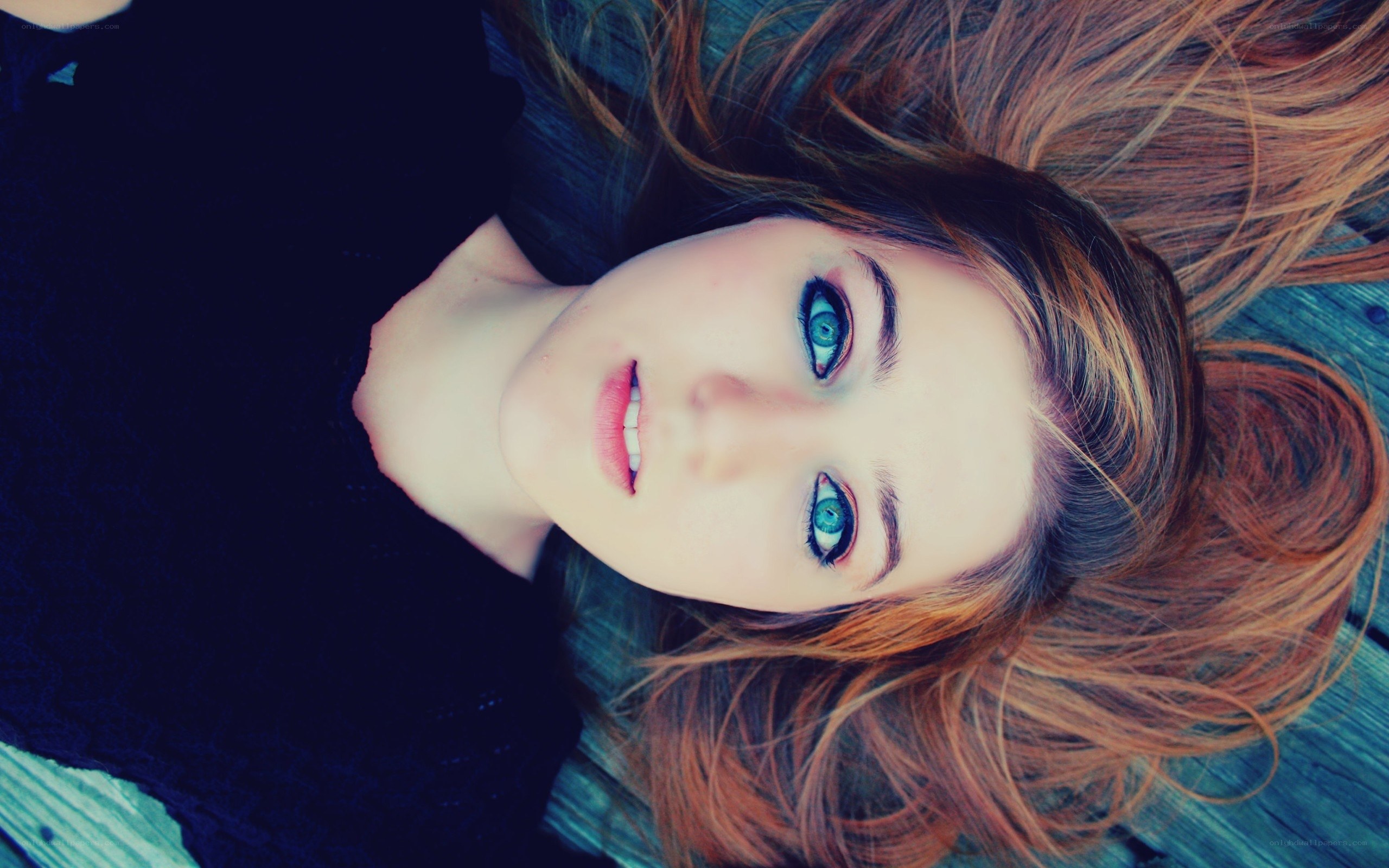 woman with blue eyes lying down