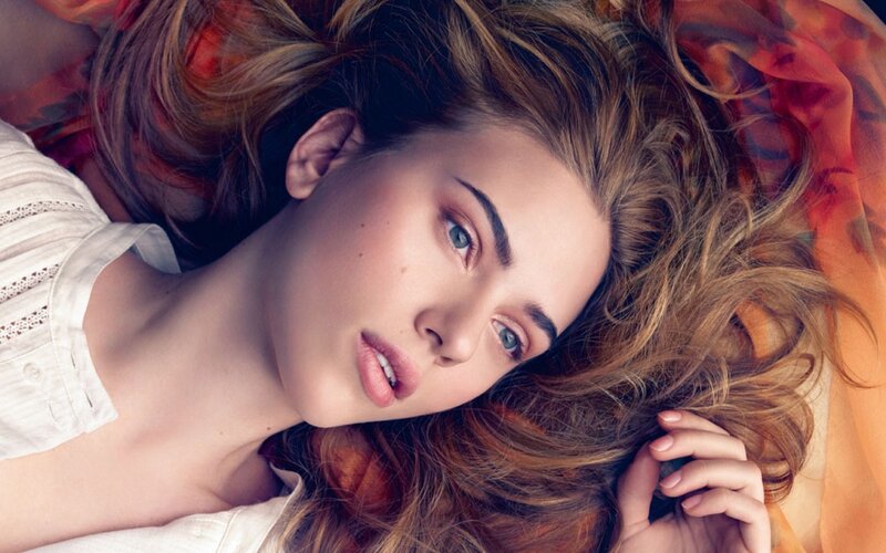 woman with blue eyes lying down