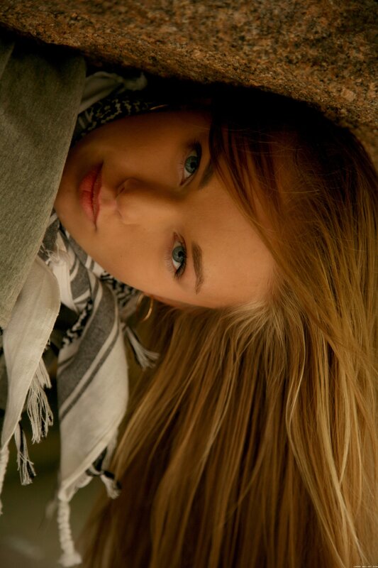 woman with blue eyes lying down