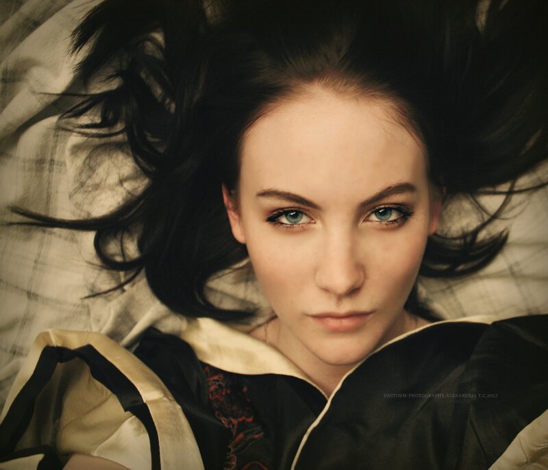woman with blue eyes lying down