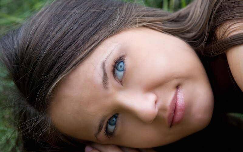 woman with blue eyes lying down