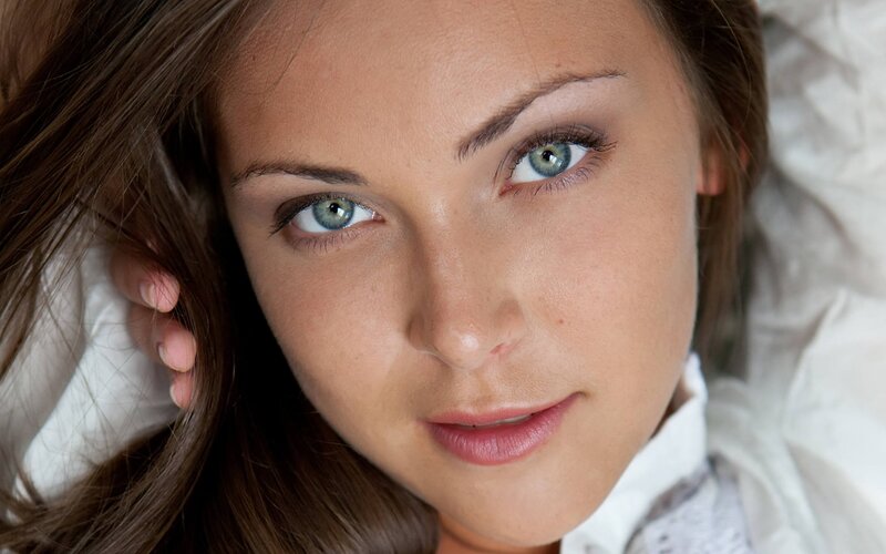 woman with blue eyes lying down