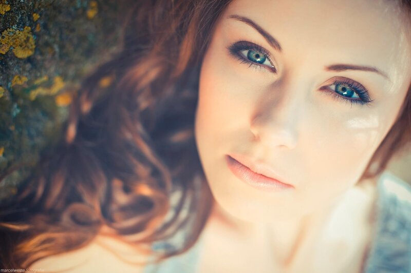 woman with blue eyes lying down