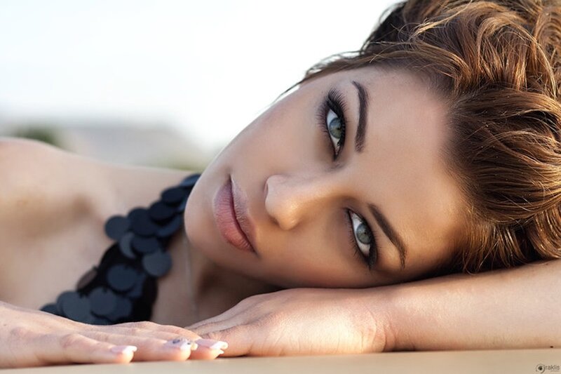 woman with blue eyes lying down