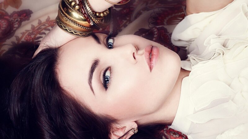woman with blue eyes lying down