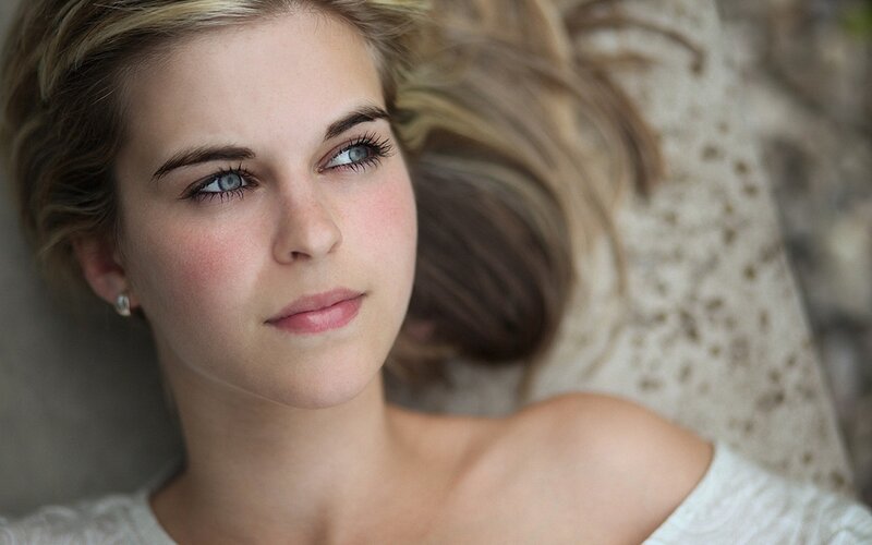 woman with blue eyes lying down