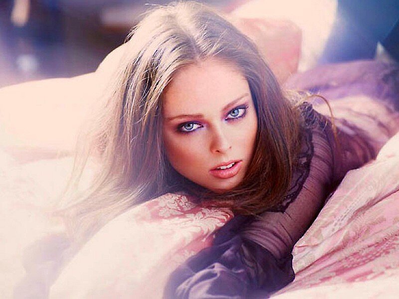 woman with blue eyes lying down