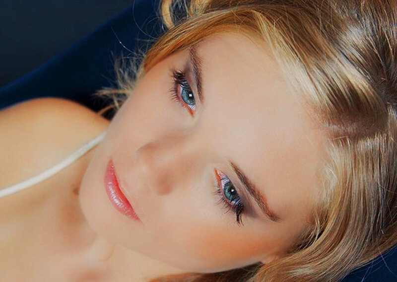 woman with blue eyes lying down