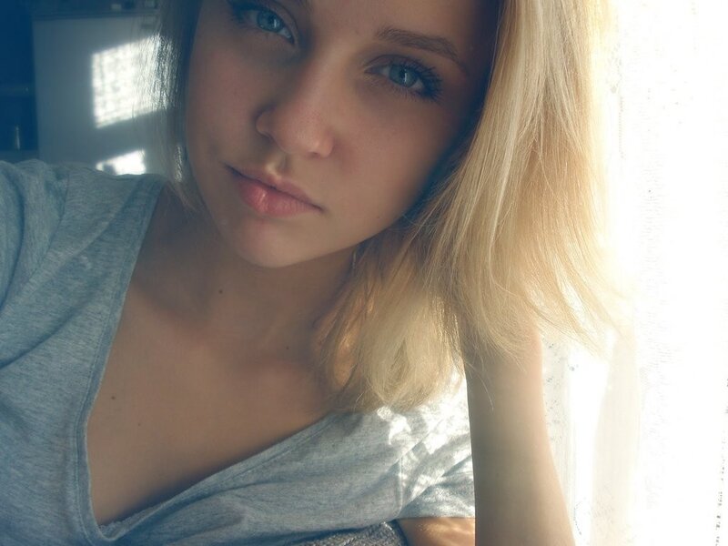 woman with blue eyes near window