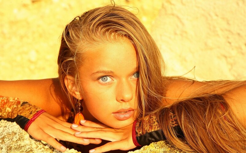 woman with blue eyes on rocky surface