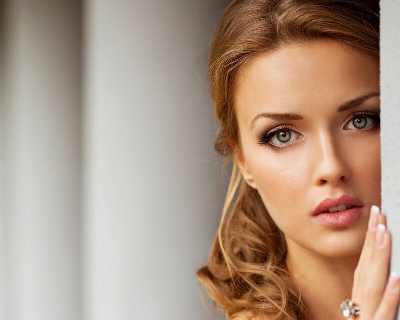 woman with blue eyes peeking