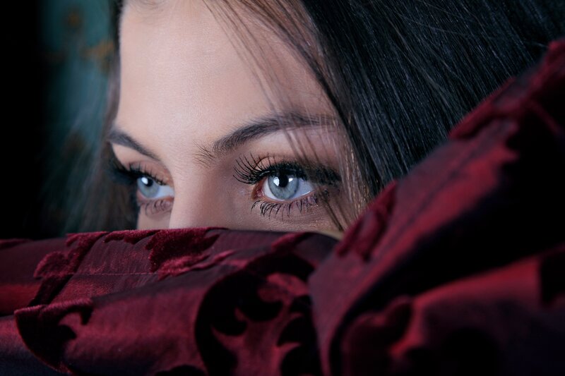 woman with blue eyes peeking