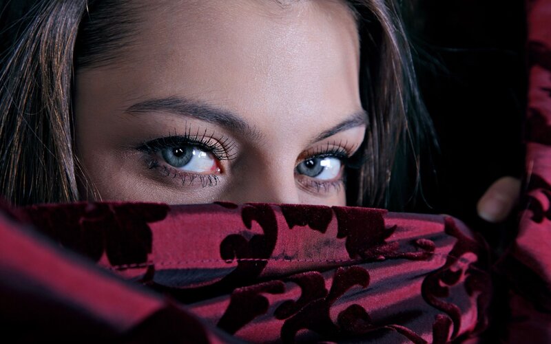 woman with blue eyes peeking