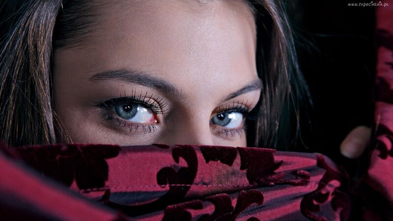 woman with blue eyes peeking