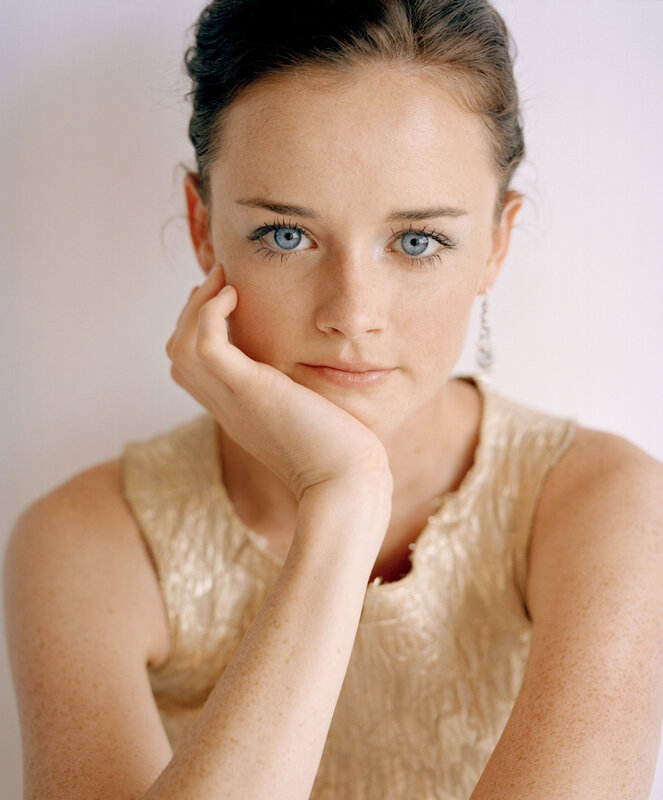 woman with blue eyes resting hand