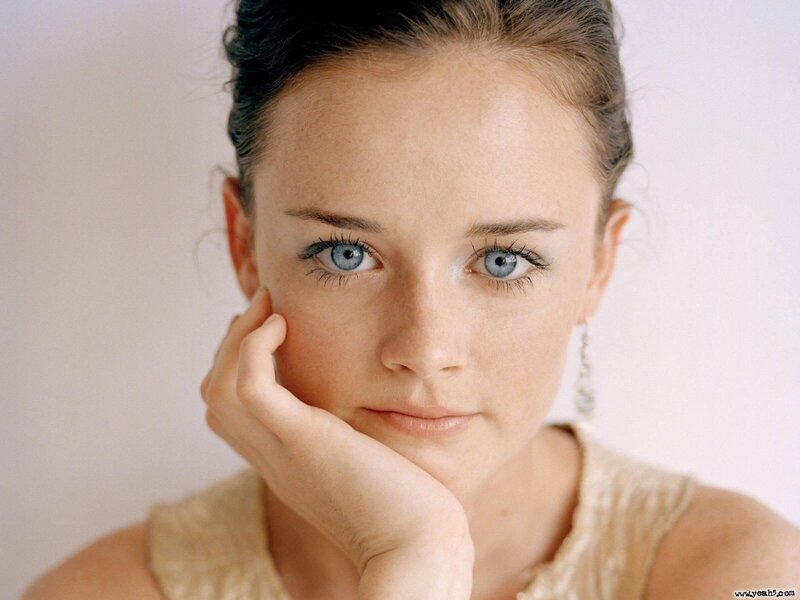 woman with blue eyes resting hand