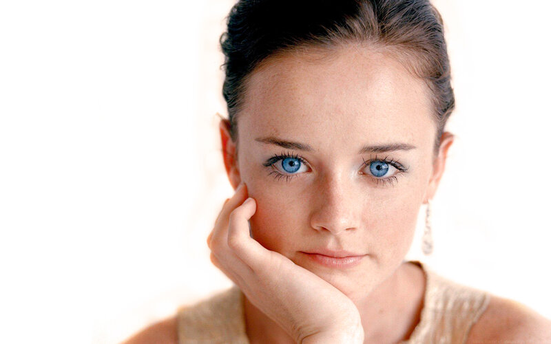 woman with blue eyes resting hand