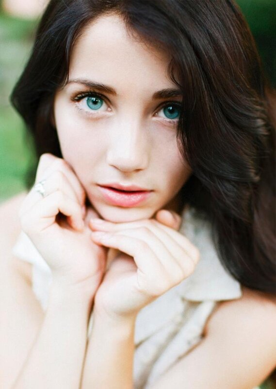 woman with blue eyes resting hands