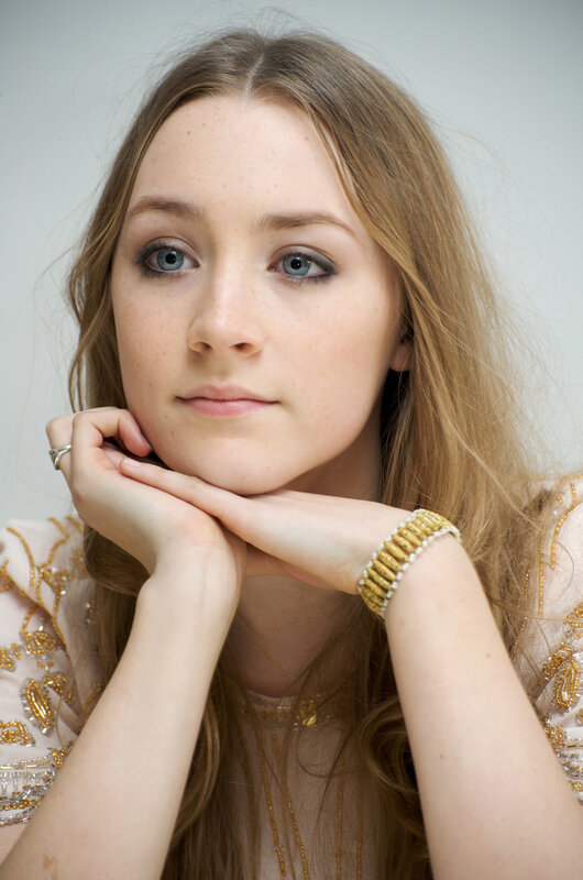 woman with blue eyes resting hands