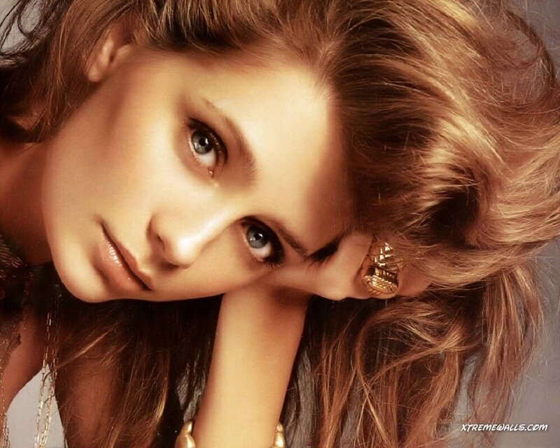 woman with blue eyes resting head