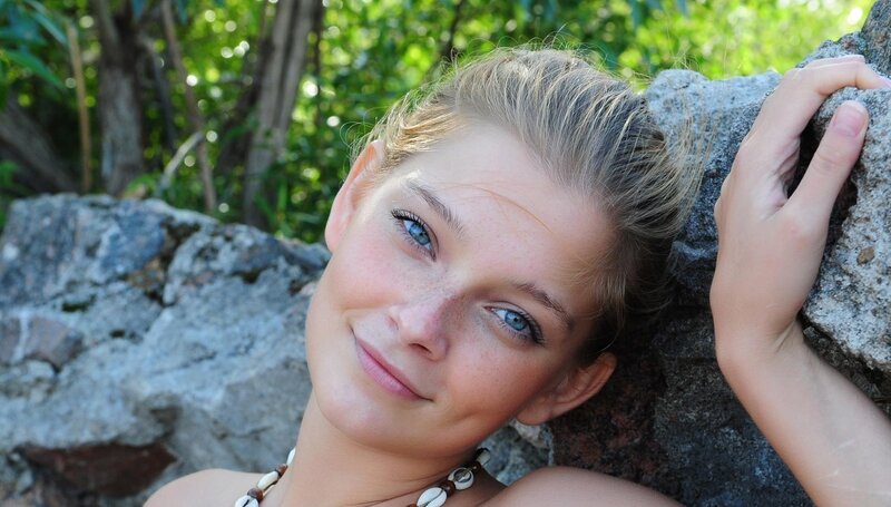 Woman with Blue Eyes — Serene, Afternoon, Photograph, Rocks