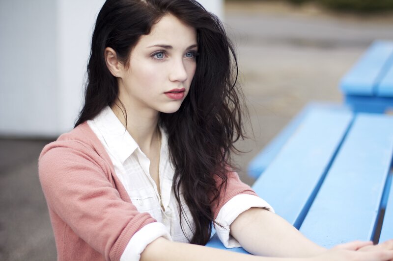 woman with blue eyes sitting outside