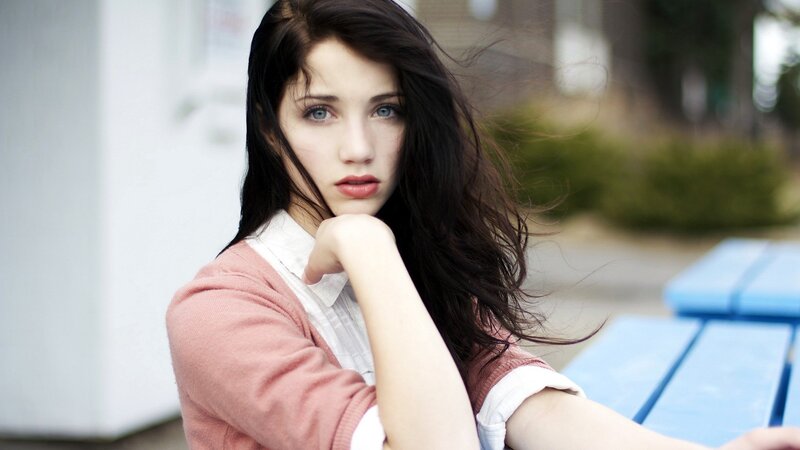 woman with blue eyes sitting outside