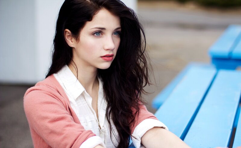 woman with blue eyes sitting outside