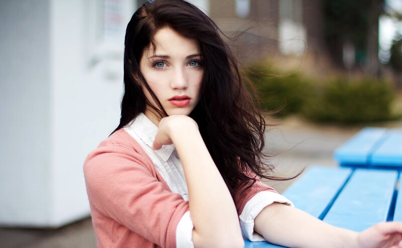 woman with blue eyes sitting outside