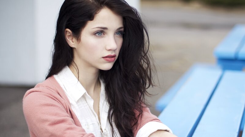 woman with blue eyes sitting outside