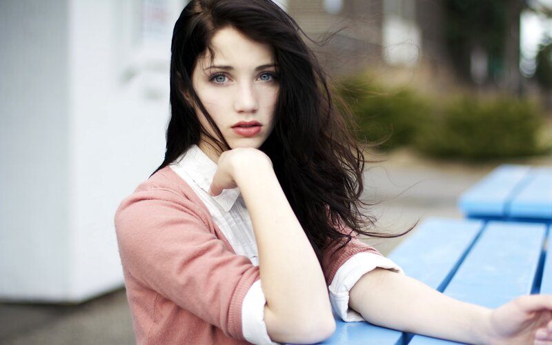 woman with blue eyes sitting outside