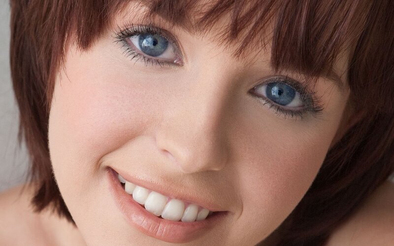 woman with blue eyes smiling