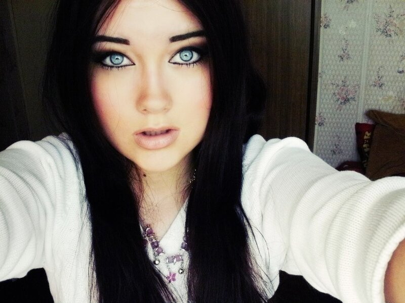 woman with blue eyes taking selfie